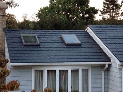 men working on a metal roof roof