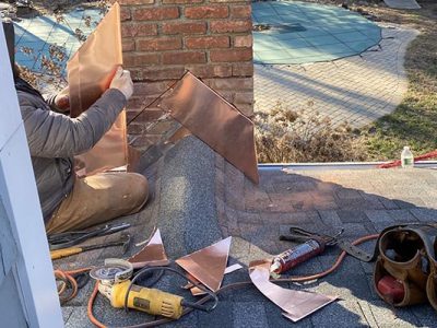 Roofing & Chimney Repair Work in Progress on a Residential Home in Long Island, NY.