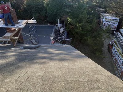 Roofing & Chimney Contractor Long Island, NY with experienced team working on residential roof and chimney repairs.